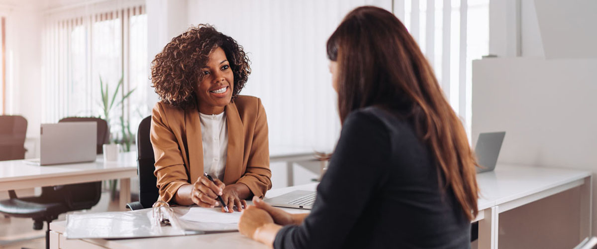 Woman consulting with a female financial manager at the bank