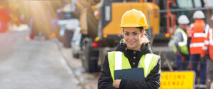 panoramic view of young female architect with construction team