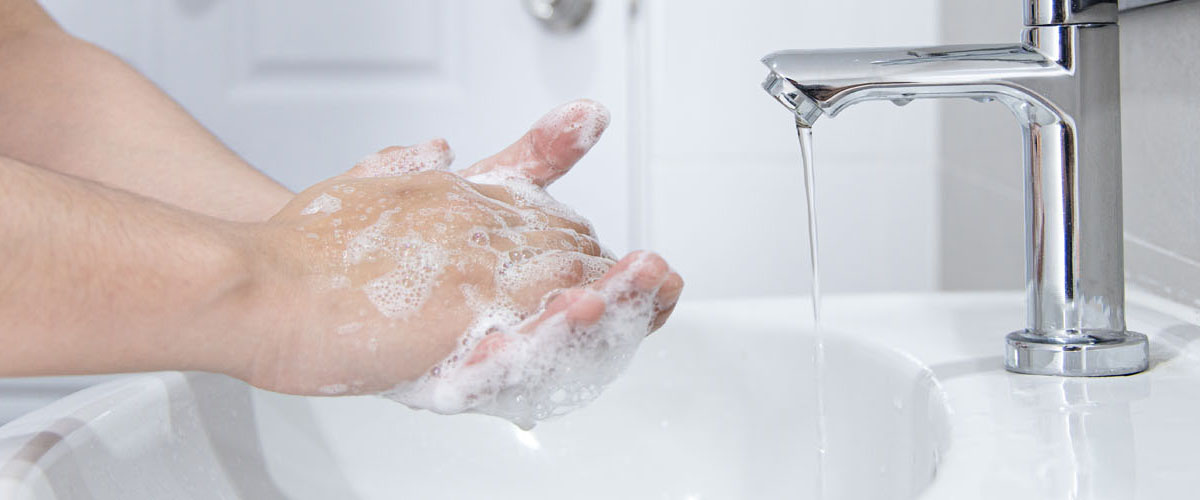 washing hands in the sink